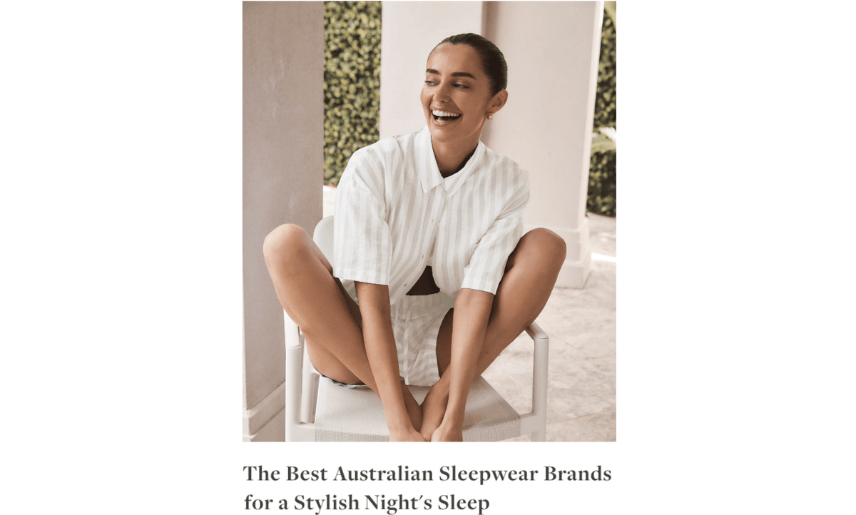 Smiling woman wearing Gingerlilly Sleepwear white striped shirt and shorts outdoors