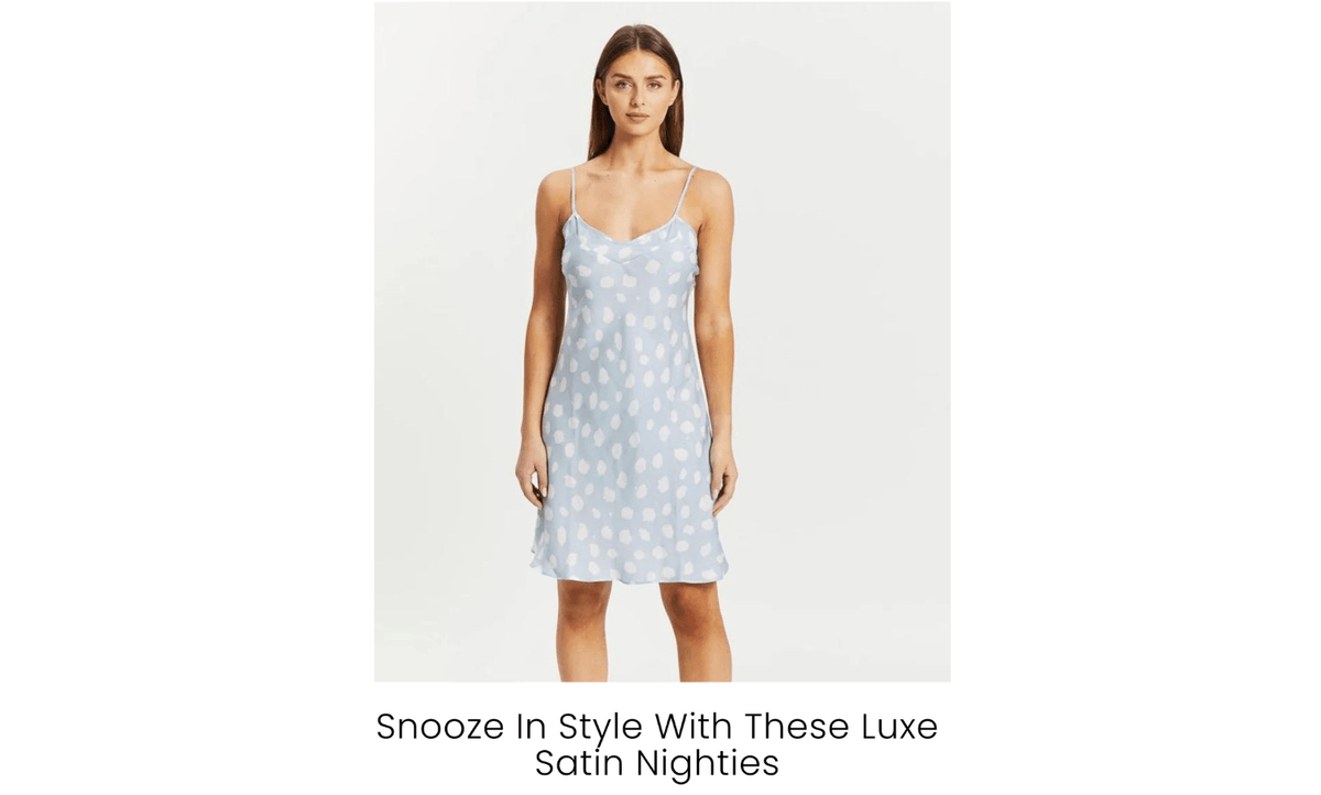 Woman wearing a blue satin nightie with white polka dots from Gingerlilly Sleepwear