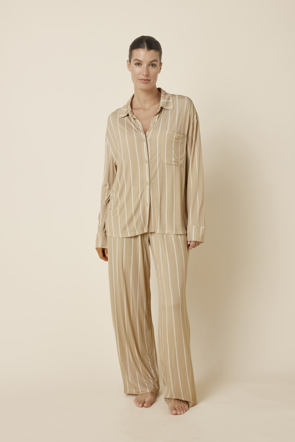 Woman wearing Harlow Bamboo Striped PJ Set biscuit from a front on view