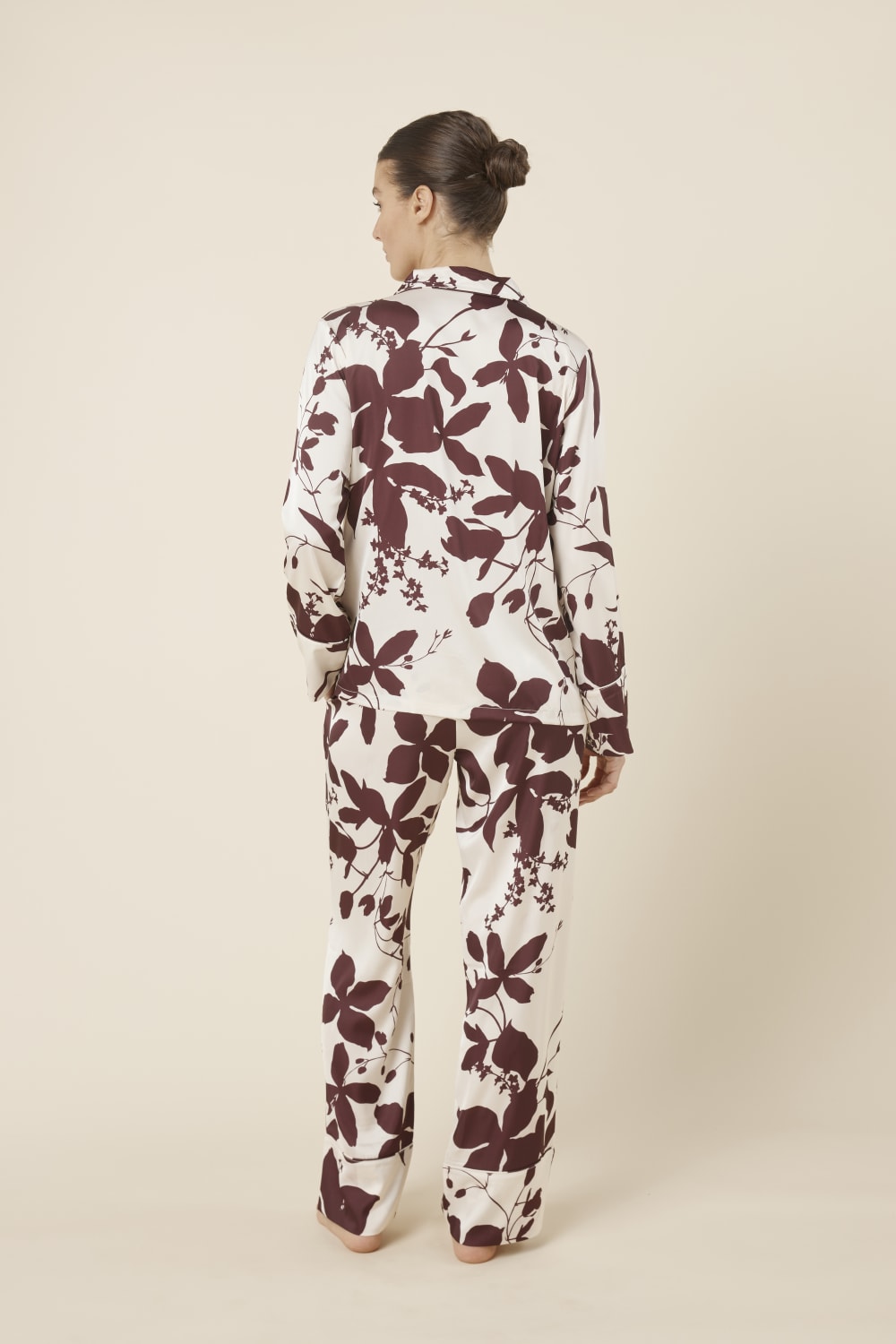 Person wearing a Ivy Silky Satin pyjama PJ set from the back view