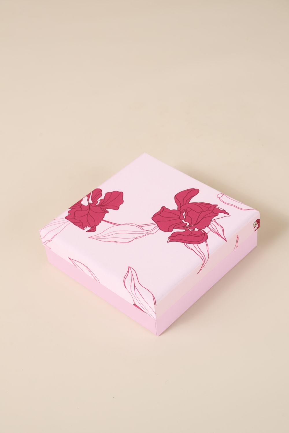 Pink floral gift box from Gingerlilly Sleepwear with red flower designs on lid