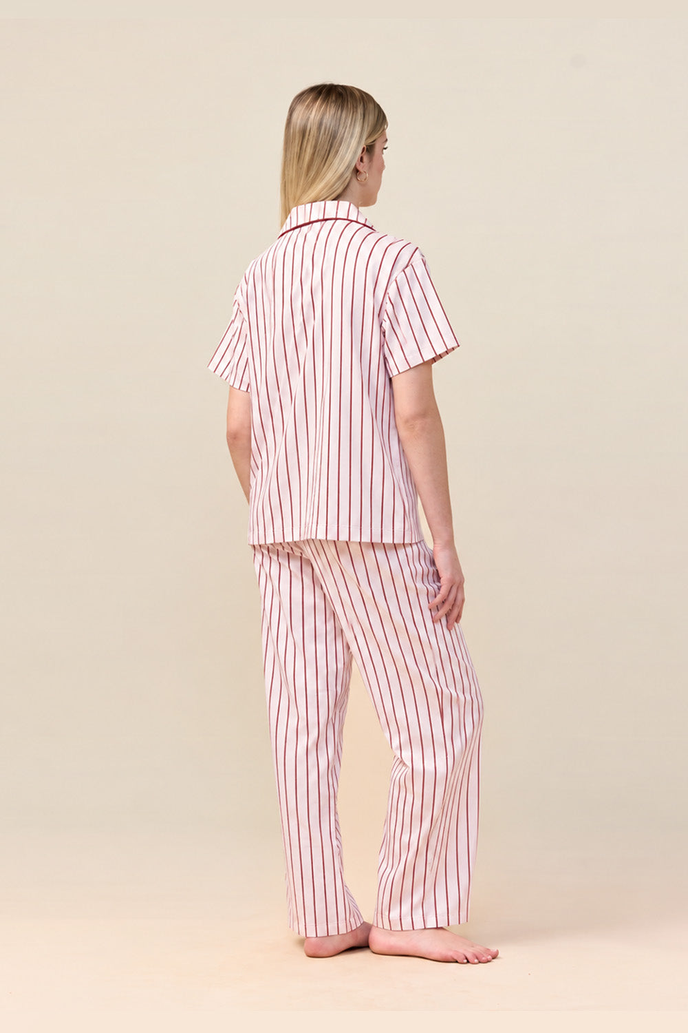 Woman wearing the Lisa Stripe Long Pant PJ Set in Pink, back view