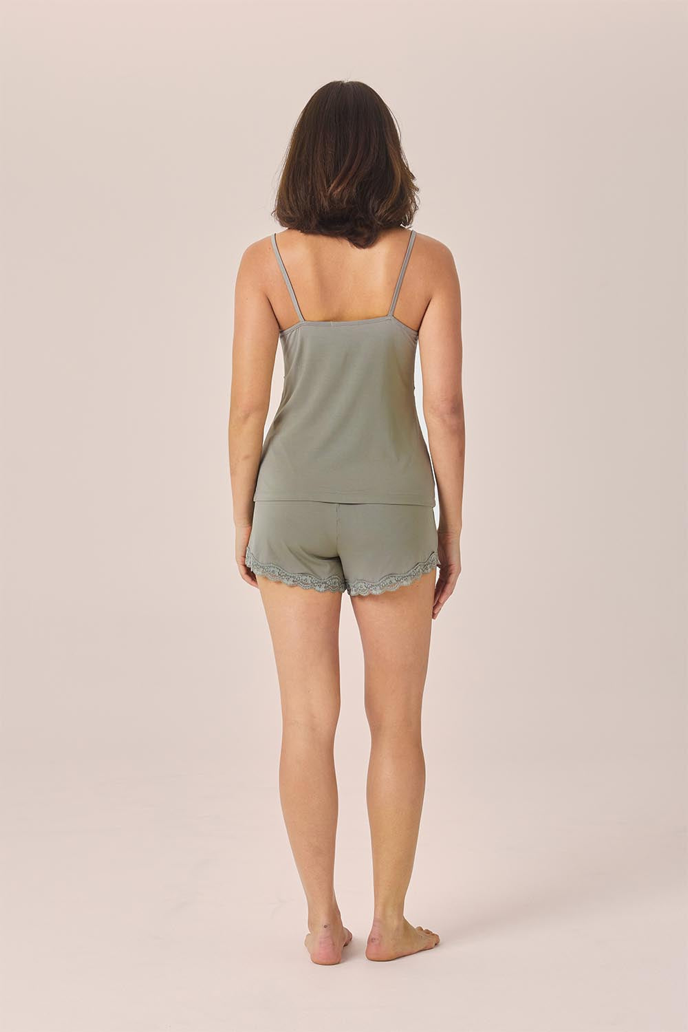 Woman wearing the Mabel Bamboo Cami and Short Set in Olive, back view