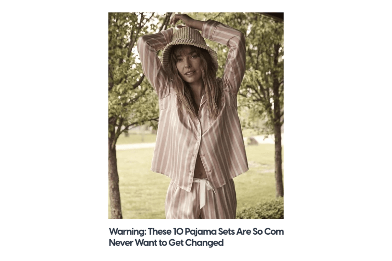 Woman outdoors wearing Gingerlilly Sleepwear pink striped pajama set and bucket hat