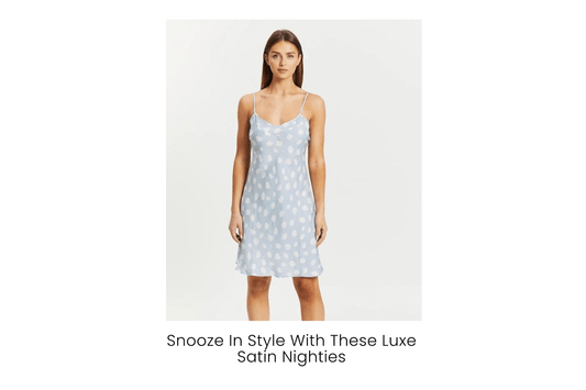 Woman wearing a blue satin nightie with white polka dots from Gingerlilly Sleepwear
