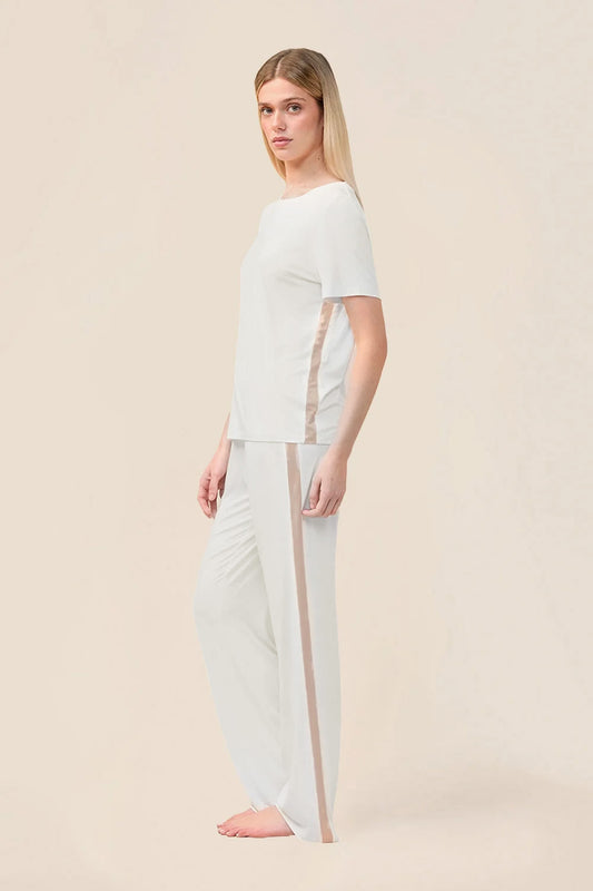 Woman wearing the Bronte Bamboo T-Shirt with Stripe in Ecru, side view