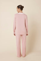 Woman wearing Grace Bamboo PJ Set Pink back view showing long sleeve shirt and full length pants