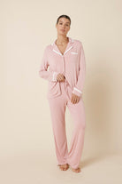 Woman wearing Grace Bamboo PJ Set Pink front view showing button shirt and relaxed straight leg pants