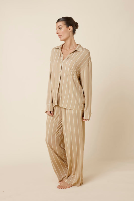 Woman wearing a Harlow Bamboo Striped pyjama PJ Set biscuit from side on view