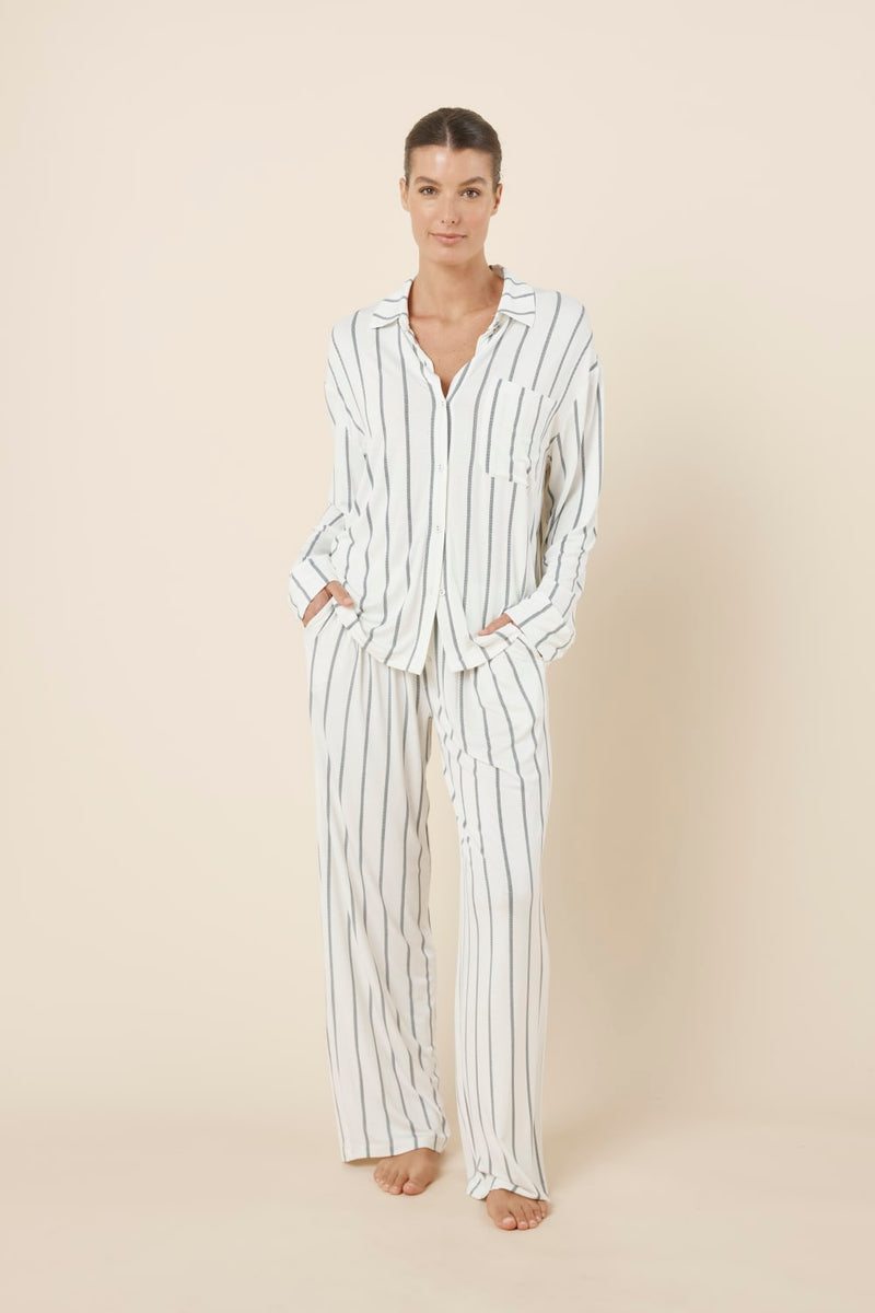Woman wearing the Harlow Bamboo Striped PJ Set Ivory front view with hands in pockets