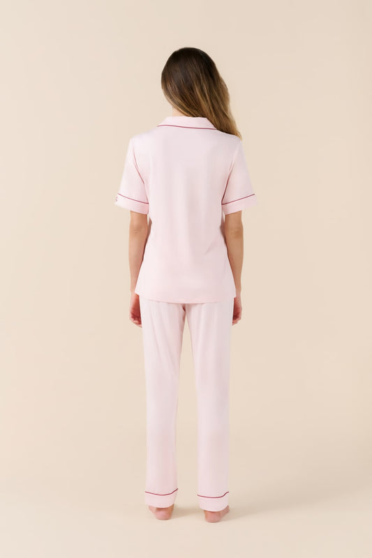Woman wearing a pink Jenna Bamboo Long pyjama PJ Set from the back view