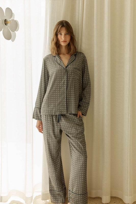 Woman wearing Kienna Geo Printed Silky Satin PJ Set standing in front of a curtain.