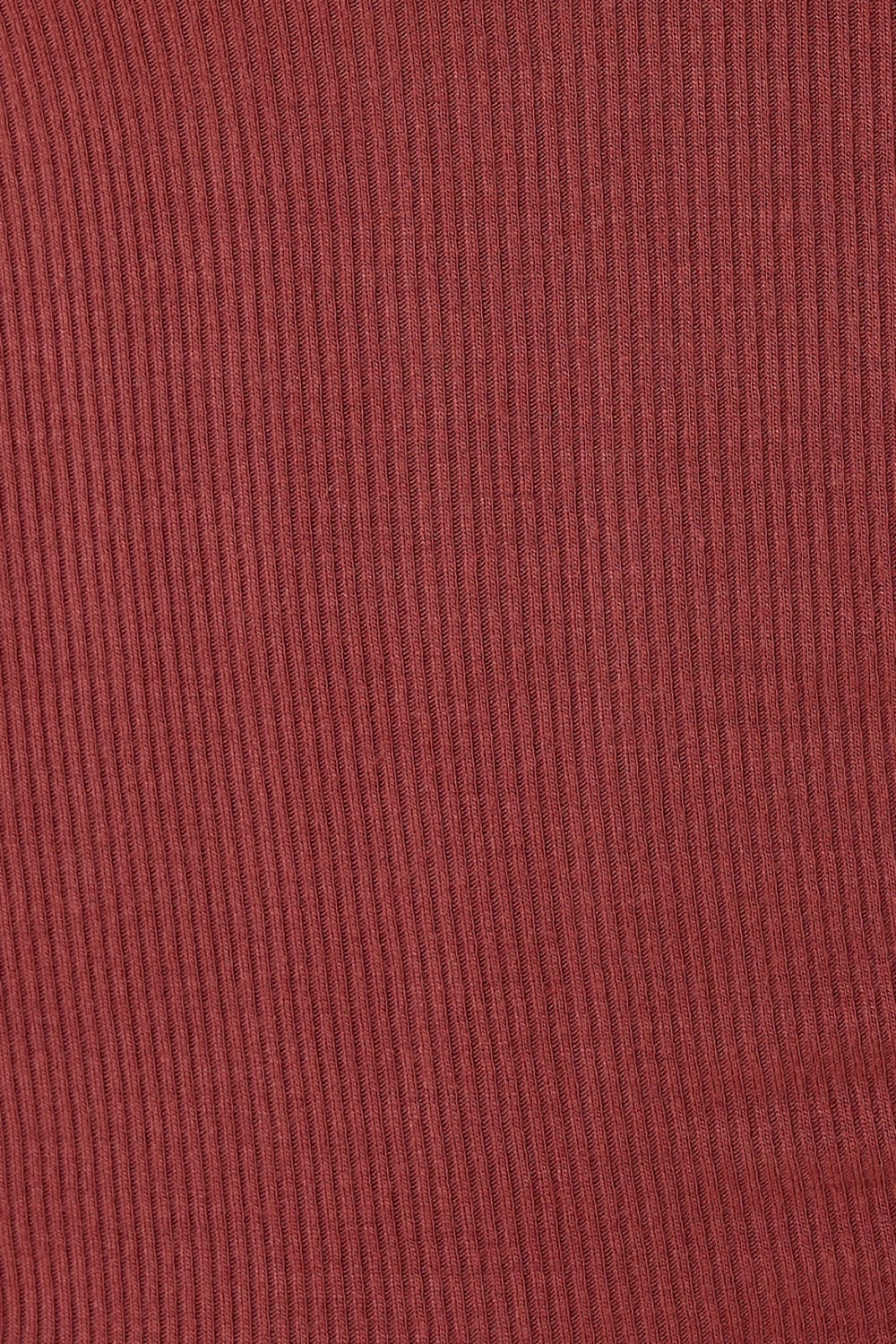 Close up of Lille Ribbed Long Sleeve Henley Top Burgundy fabric showing the vertical ribbed texture and soft stretch material.