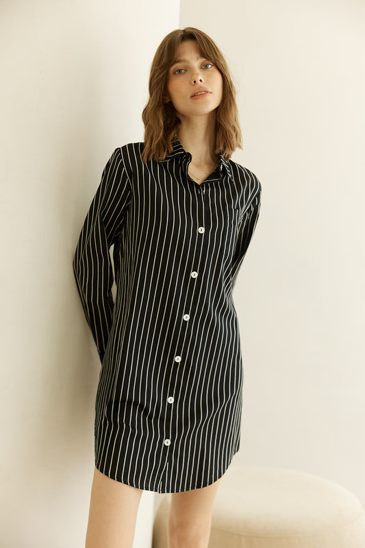 Woman wearing a black and white striped Lolita Stripe Night Shirt dress against a plain background