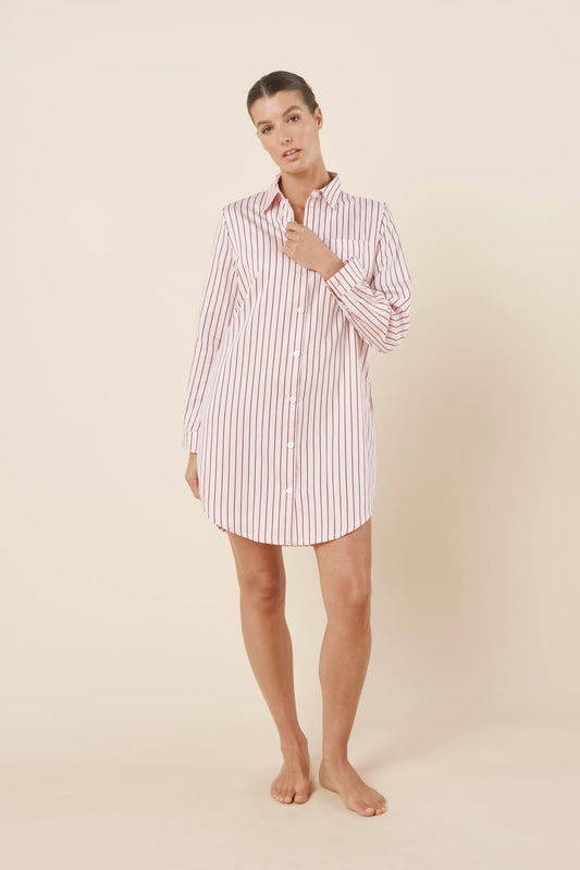 Woman wearing a pink striped Lolita Stripe Night Shirt dress against a beige background front on view