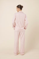 Woman wearing Octavia Cotton Stripe PJ Set Pink, back view of breathable cotton pyjama set with piped cuffs
