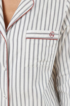 Octavia Cotton Stripe PJ Set close up of striped cotton shirt pocket with monogram embroidery and red piping