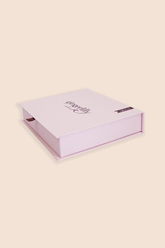 Gingerlilly Sleepwear pink gift box with logo, photographed on a light background