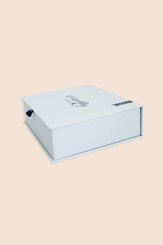 Pale blue Gingerlilly Sleepwear gift box on a beige background, featuring brand logo.