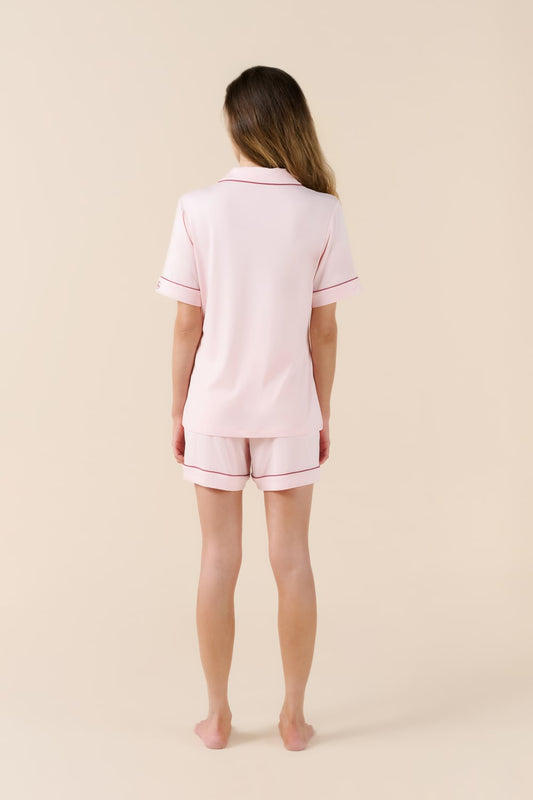 Woman wearing Gingerlilly Sleepwear bamboo short pyjama set in pale pink, back view