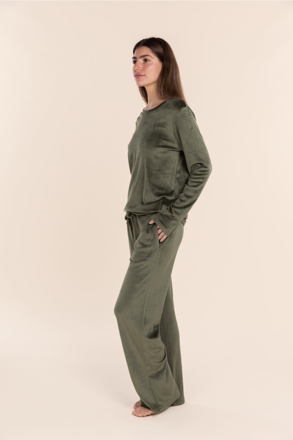 Thea Velour Long Lounge Set Olive side profile view highlighting the fluid drape of the long sleeve top and relaxed wide leg pants.