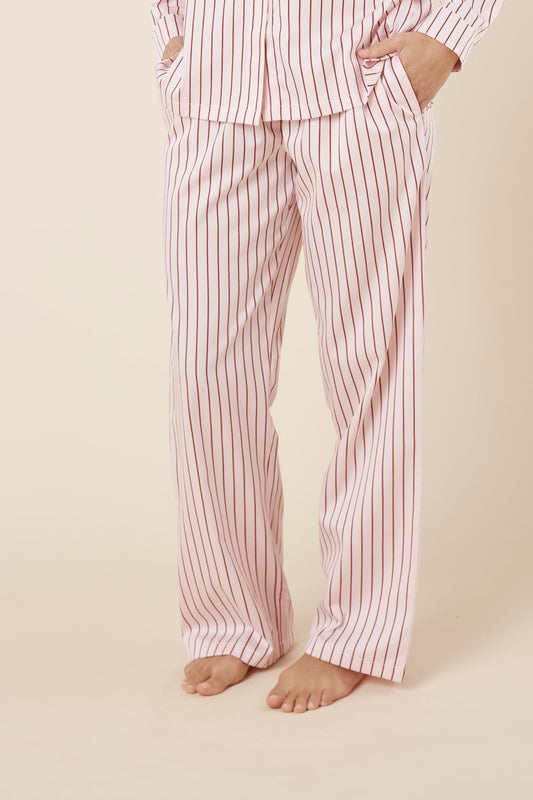 Willow Cotton Striped Pyjama Pants in Pink worn by a person on a beige background