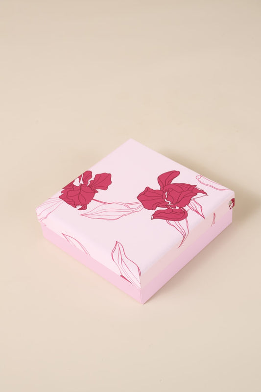 Pink floral gift box from Gingerlilly Sleepwear with red flower designs on lid