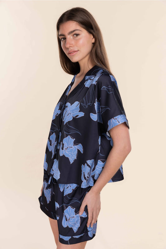 Woman wearing Gingerlilly Sleepwear navy floral cotton short set, side view