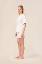 Woman wearing the Helena Short Bamboo PJ Set in Ecru, angled front view