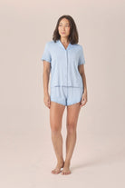 Woman wearing the Joni Bamboo Short Set with Lace in Blue, front view of short sleeve shirt and shorts