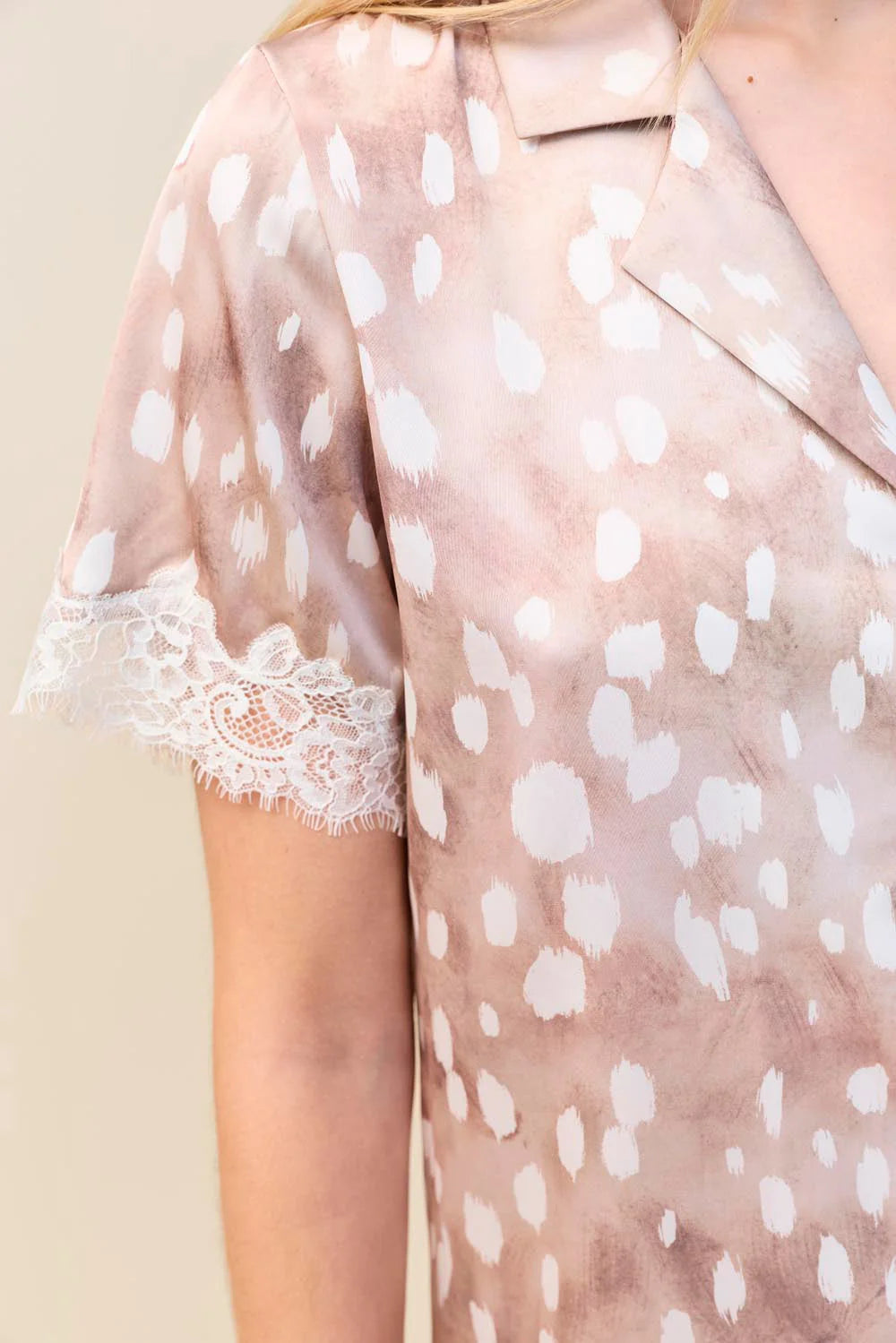 Close-up of the Lydia Bambi Print Short Set in Brown, showing the collar and lace-trimmed sleeve