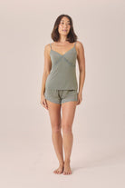 Woman wearing the Mabel Bamboo Cami and Short Set in Olive, front view of lace-trim cami and shorts
