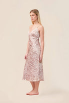 Woman wearing the Melody Bambi Print Spot Nightie in Brown, angled side view
