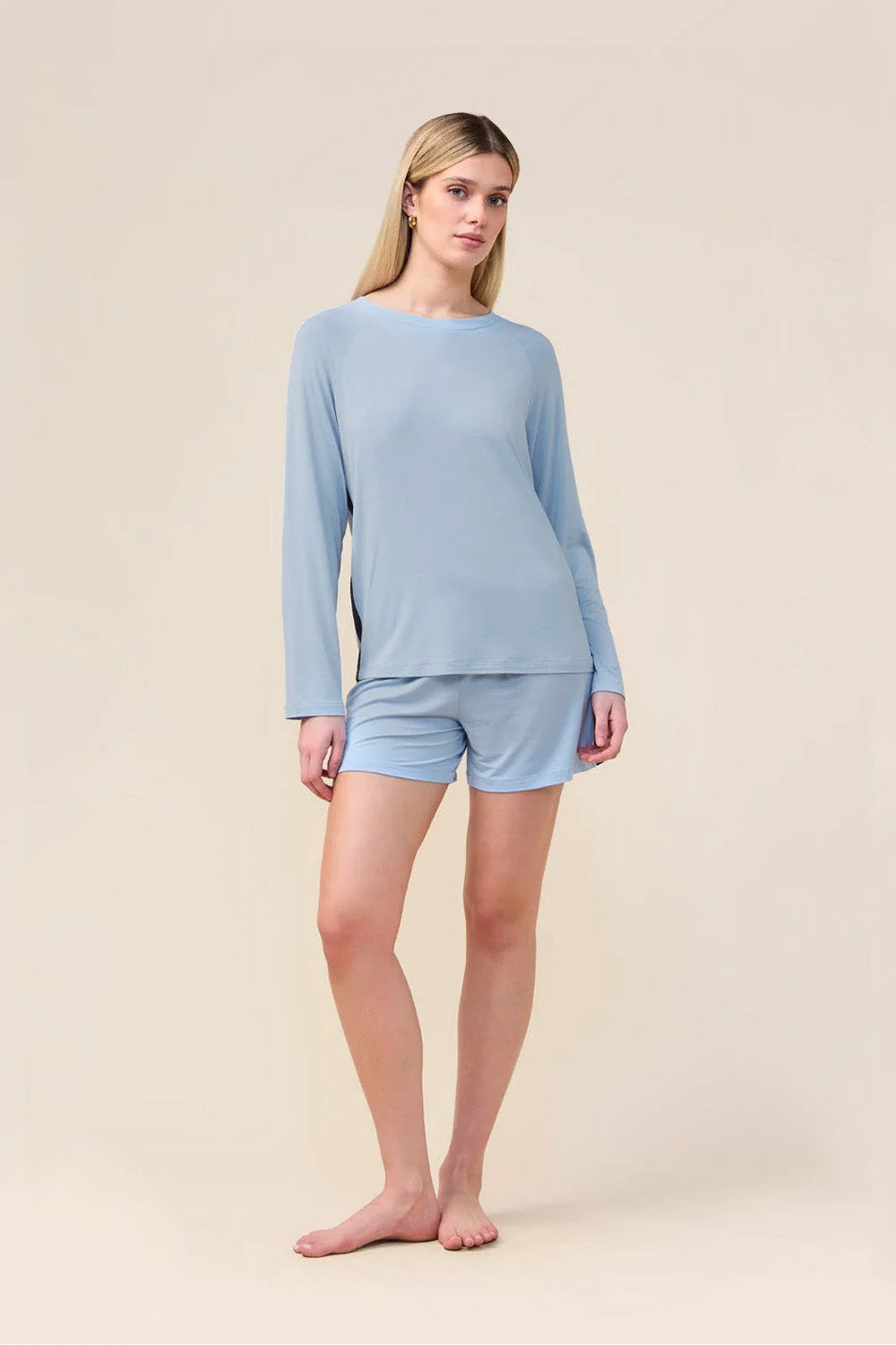 Woman wearing the Solene Long Sleeve Top with Stripe in Blue, front view