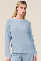 Woman wearing the Solene Long Sleeve Top with Stripe in Blue, close front view