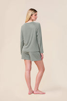 Woman wearing the Solene Long Sleeve Top with Stripe in Olive, back view