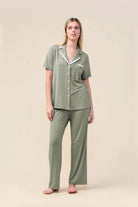 Woman wearing the Vanessa Bamboo Long Pant PJ Set in Olive, front view with white contrast trim