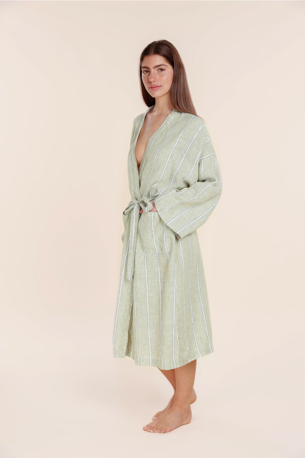 Woman wearing Olive Stripe long cotton robe from Gingerlilly Sleepwear, standing barefoot