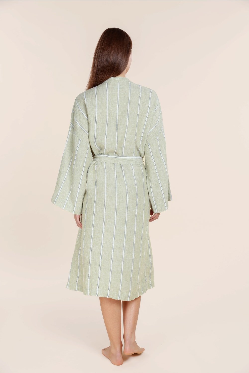 Woman wearing Gingerlilly Sleepwear olive striped robe, back view, natural fabric