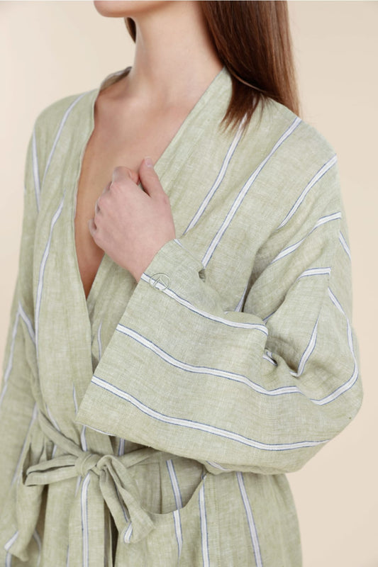 Woman wearing Gingerlilly Sleepwear olive green striped robe made from natural fabric