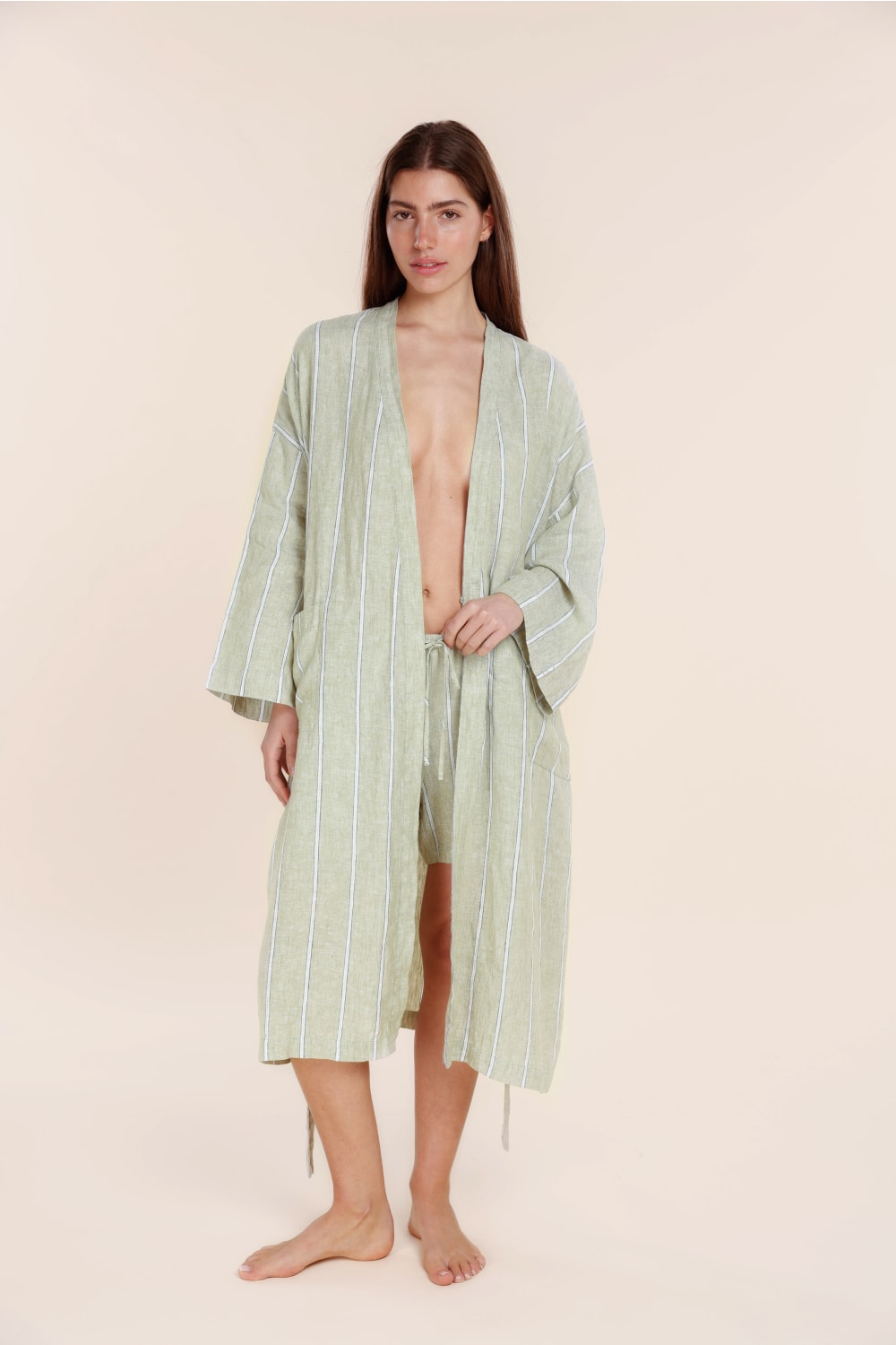 Woman wearing Gingerlilly Sleepwear olive stripe cotton robe and shorts set