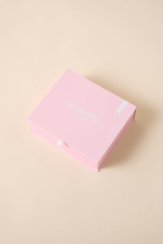 Gingerlilly Sleepwear pink gift box on beige background, Australian natural fabrics